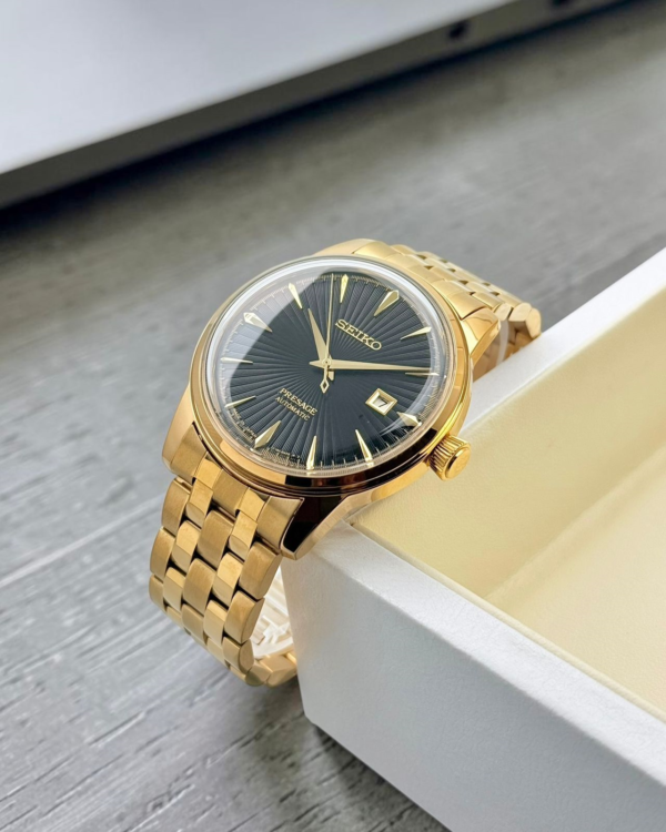 Gold-tone black dial automatic watch